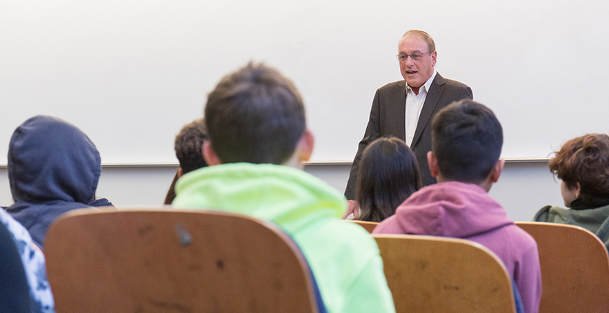Marvin Raab speaking to a classroom of students